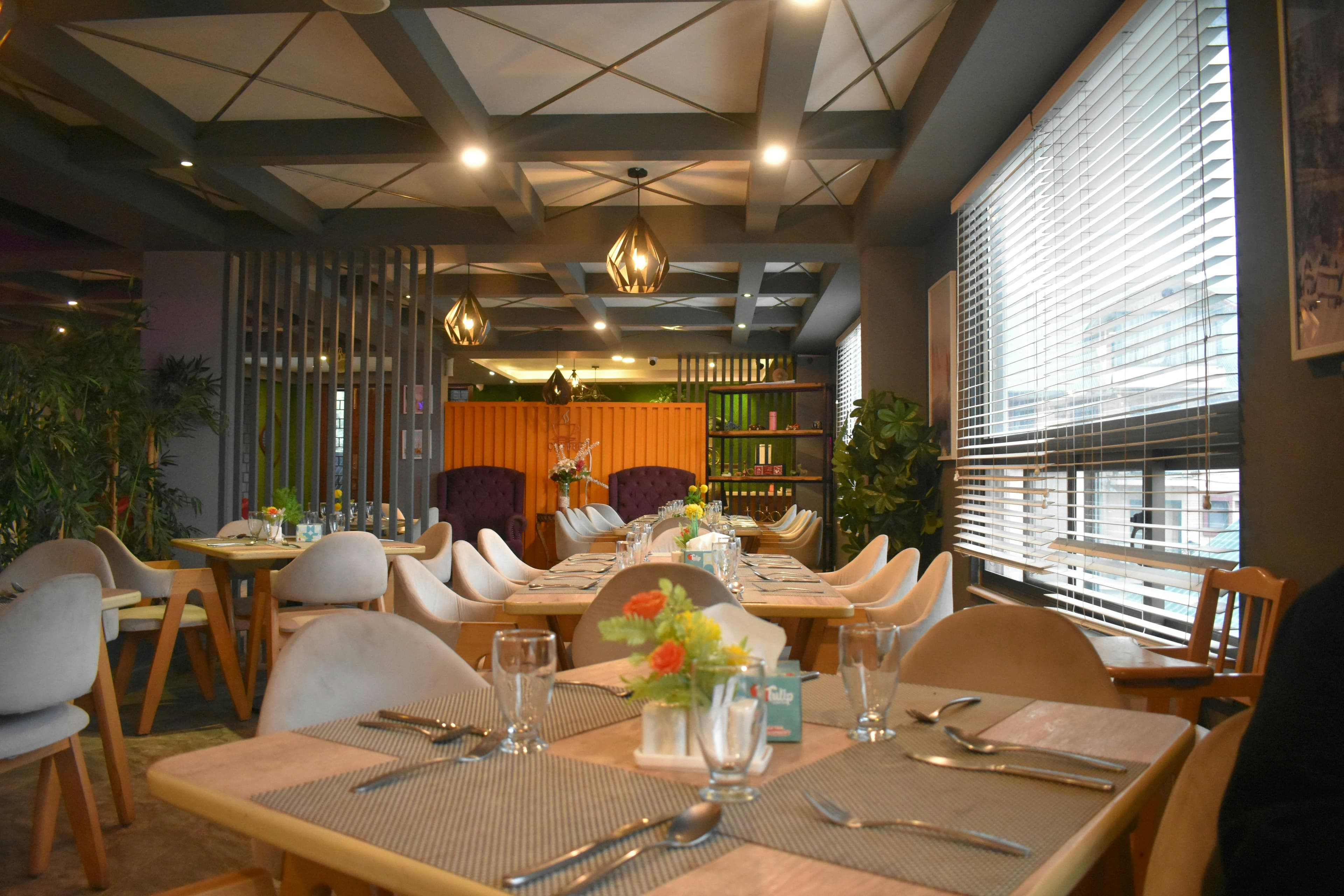 Sage & Thyme restaurant interior featuring elegant dining setup with warm lighting